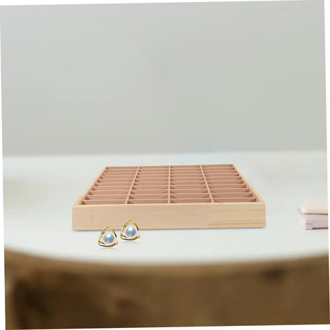 Vintage Wood Jewelry Dish With Integrated Smartphone Stand Multi Compartment Accessory Organizer For Rings And Chains on a table with earrings.