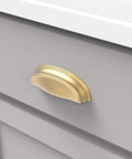 Solid Core Cabinet Pulls In Brushed Golden Brass Finish For Doors And Dresser Drawers, Luxury Hardware With Three Inch And Three Quarter Inch Hole Centers, Length Four And Five Eighths Inch, Width One And A Half Inch, Projection One Inch installed on grey drawer
