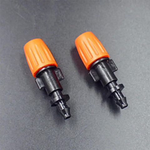 Two adjustable drip heads for 50 Piece Garden Micro Flow Drippers Sprinklers Emitter Set With Adjustable Drip Heads For Watering Systems.