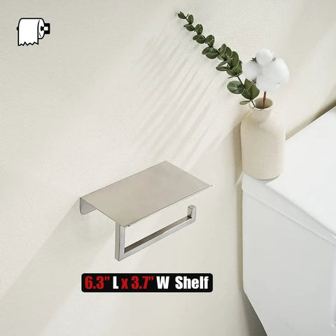 Toilet Paper Holder With Phone Shelf Fits Five Inch Rolls 304 Stainless Steel Brushed Finish Wall Mount Bathroom Organizer Large Six Point Three Inch Shelf For Phones And Small Items No Slip Stop installed on wall next to a vase
