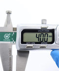 Close-up of digital caliper measuring a small metal shielded ABEC-5 ball bearing, 4.00 mm bore