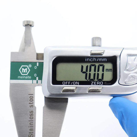 Close-up of digital caliper measuring a small metal shielded ABEC-5 ball bearing, 4.00 mm bore
