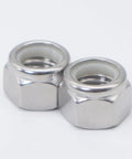 Close-up of two 4-40 Nylock Nuts, 304 Stainless Steel Nylon Insert Lock Nuts, Silver, for bolts, self-locking hardware