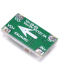 Top view of Adjustable UBEC Power Module 5V 3A Or 12V 2A for RC Drones, showing input-output terminals and green circuit board.