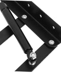 Close-up of black drop leaf hinges for folding furniture showing spring-loaded design.