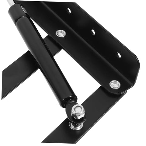 Close-up of black drop leaf hinges for folding furniture showing spring-loaded design.