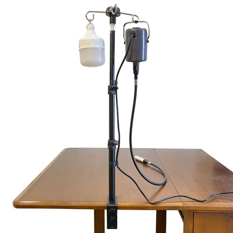 Rock Solid Rotary Tool Stand With Adjustable Height Table Clamp And Flexible Shaft Hook Rack For Dremel Foredom Shops mounted on a table.