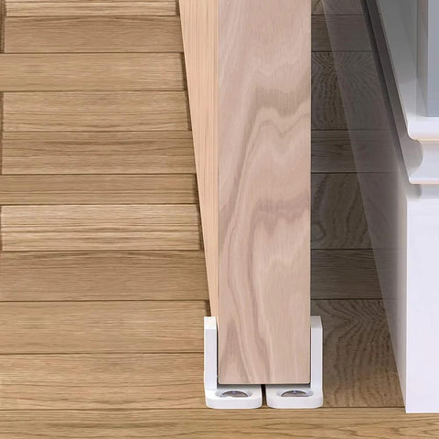 Side view of installed 4 Pack POM Plastic T Shape Adjustable Sliding Barn Door Floor Guides With Screws White Finish on wooden floor
