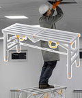 Man using Sturdy Folding Work Platform with Adjustable Height Scaffold and Built In Workbench Stool for Home Improvement