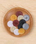 Colorful plastic screw cap covers on a wooden plate