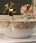 USZWBY Bathroom Vessel Sink, Countertop Basin Ceramic Sink, round white sink with gold floral design, elegant bathroom decor.
