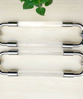 Stainless Steel Clear Acrylic Door Hardware Kit For Front Doors And Glass Panels with Double Sided Grab Bar on light wood surface