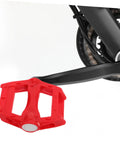 Red 2 Pack Mountain Bike Pedals For Kids And Adults attached to bike crank, showing grippy surface for stable rides on trails or streets.