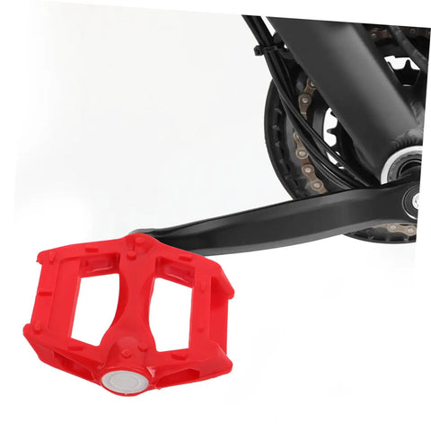 Red 2 Pack Mountain Bike Pedals For Kids And Adults attached to bike crank, showing grippy surface for stable rides on trails or streets.