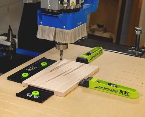 Low Profile Clamp Kit for CNC Machines MFT Tables Dog Tables T Track Tables and Work Benches shown securing wood on CNC machine