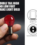 Person holding 12V 21/5W Halogen Brake Light Bulb With BAY15D Base, Dual High Low Filament, Stable Brightness, Red