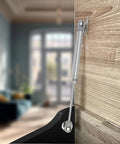 Two Pack Soft Close Toy Box Hinges With 100N Gas Strut Safety Lid Support on wood cabinet, matte silver finish.