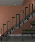 Tough As Nails Industrial Pipe Railing Featuring Slick Non Slip Iron Guardrail for Indoor Outdoor Steps and Decks on a staircase.