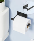 Self-Adhesive Toilet Paper Holder No Drill Matte Black Stainless Steel Wall Mounted for Bathroom, Kitchen, Washroom, and RV Waterproof Rustproof Holds Up To 2.5 Kg Easy Install, Heavy Duty Toilet Roll Holder installed next to a toilet