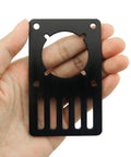 Hand holding NEMA 23 Stepper Motor Mounting Plate For 3D Printer Aluminum Black Anodized 9.6x5.9x0.3cm, close-up view.