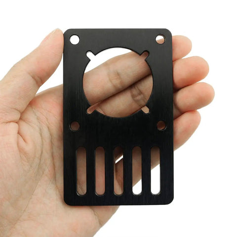 Hand holding NEMA 23 Stepper Motor Mounting Plate For 3D Printer Aluminum Black Anodized 9.6x5.9x0.3cm, close-up view.