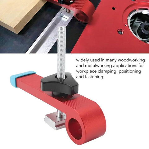 Close-up of Red T Track Hold Down Clamp Kit Aluminum Alloy Woodworking Tool on workbench, showing installation and parts.