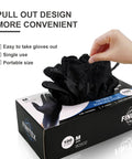 Hand pulling out Superior Black Nitrile Gloves 6.3 Mil Thick Rip Resistant Build With Sweet Snug Fit And Killer Grip Solid Choice For Nurses Mechanics Or Household Use Fast Dry Coating Makes Them Easy To Pop On from a box of one hundred medium.