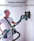 Man using Beast 800W Electric Drywall Sander With 5 Speed Settings Foldable Design for smooth plasterboard wall sanding.