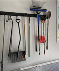 13 Piece Tool Storage Rack Kit With 64 Inch Adjustable Garage Organization Wall Mounted System And 9 Hooks For Heavy Duty Steel Garden Tools, Brooms, Shovels, And More installed with tools hanging