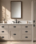 Four Pack Matte Black Cabinet Knobs With Sleek Backplates Showcasing Vintage Floral Petal Details on a modern kitchen vanity.