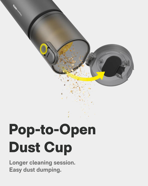 Open dust cup of HOTO 4 in 1 Portable Mini Vacuum showing dirt release, illustrating easy cleaning.