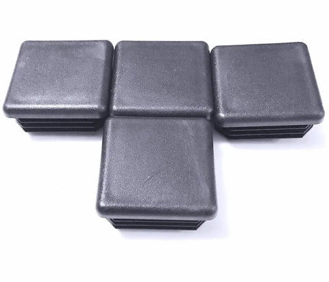 Rock Solid Pack Of Four 1.5 Inch Square Black Plastic Tubing Plugs With Grippy Ribbed Inserts arranged on a white background.