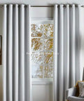 Living room with white curtains and grommets for DIY installation using 1.5 Inch Grommet Tool Kit for Curtains and Drapes for DIYers.