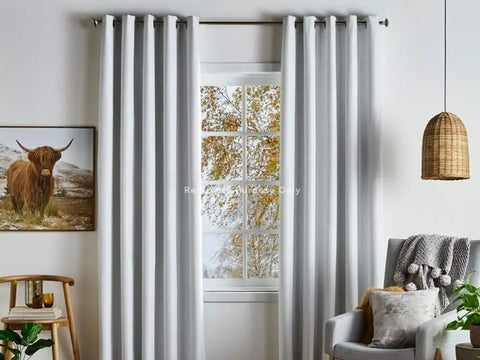 Living room with white curtains and grommets for DIY installation using 1.5 Inch Grommet Tool Kit for Curtains and Drapes for DIYers.
