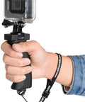 Person holding Ergonomic Camera Grip Stabilizer Rig for DSLR Mirrorless and Camcorder, visible with selfie stick mount and wrist strap.