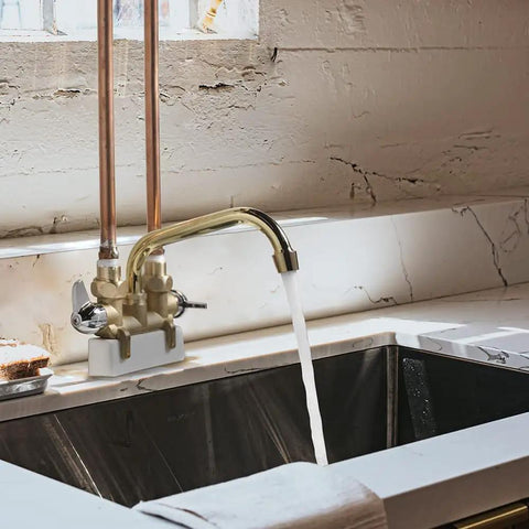 Two Handle Laundry Faucet With 7 Inch Rough Brass Swivel Spout Drip Free No Fuss Quarter Turn Valve Garden Hose Connection Removable Aerator For Easy Reach To Clean Every Side Of Your Wash Tub in a laundry sink.