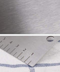 Close-up of Cake Scraper And Leveling Tool Set Stainless Steel With PP Handle Adjustable Frosting Spatula on fabric