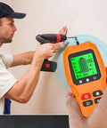 User operating 7 in 1 Smart Stud Finder Wall Scanner with LCD Display while drilling into the wall for accurate stud location.