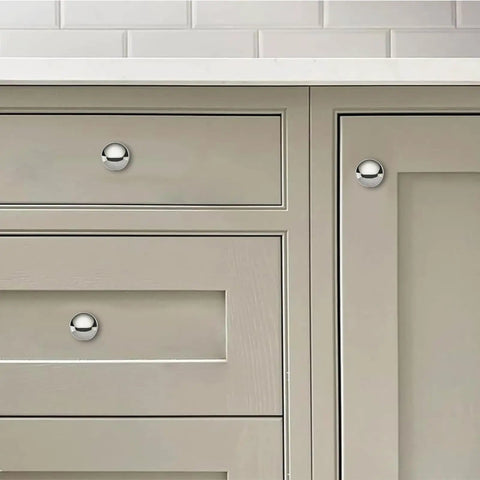 Two Pack One Half Inch Bifold Closet Door Knobs Polished Nickel Zinc Alloy Cabinet Handles on gray cabinetry.