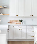 Slick Antique Brass Cabinet Knobs 6 Pack Solid Zinc Alloy Hardware Vintage Kitchen Drawer Knobs in modern kitchen setting.