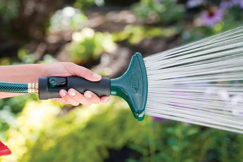 Person using Rain Like Spray Hose Nozzle With Comfort Grip For Garden Watering Durable Metal Body And Rubberized Non Slip Handle