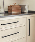 Matte Black Cabinet Pull For Modern Cabinets And Furniture Monument Collection 13 Inch Overall Length 12 5 8 Inch Center To Center Mounting Durable Metal Drawer Pull Amerock BP36911FB installed on light cabinets