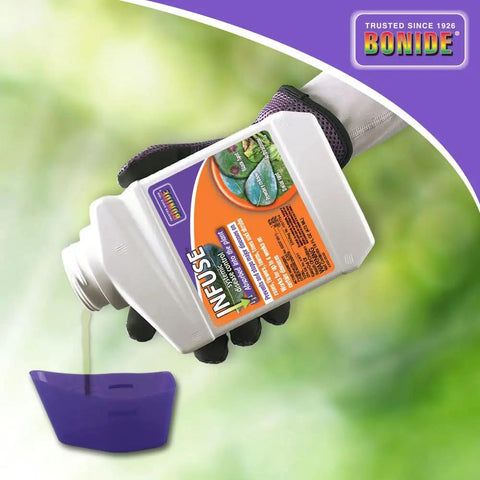 Person pouring Infuse Systemic Disease Control Concentrate from a white container, used for lawn and ornamentals, into a measuring cup.