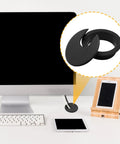 2 Inch Black Desk Grommet Cable Hole Cover For Easy Cable Management On Home Office Desks TV Stands And Tabletops Plastic With Detachable U Shaped Lid 2 Pack shown in use on a desk setup.