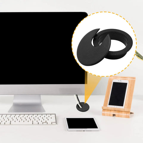 2 Inch Black Desk Grommet Cable Hole Cover For Easy Cable Management On Home Office Desks TV Stands And Tabletops Plastic With Detachable U Shaped Lid 2 Pack shown in use on a desk setup.