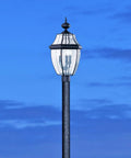 Lancaster Outdoor Post Lantern Three Light Outdoor Fixture With Slick Black Finish against blue sky