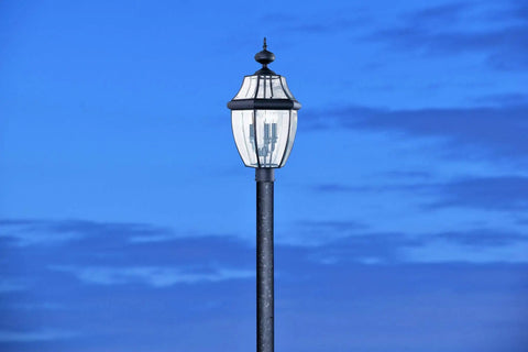 Lancaster Outdoor Post Lantern Three Light Outdoor Fixture With Slick Black Finish against blue sky