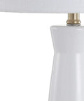 White And Brass Modern Ceramic Column Table Lamp With Gold Base, Sleek Bedside Light featuring a white linen shade and ceramic column.