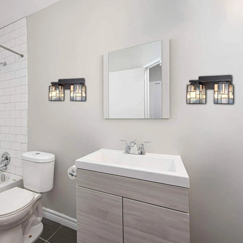Tiffany Style 2 Light Wall Sconce With Hand Made Stained Glass Shade in modern bathroom, above white sink and mirror