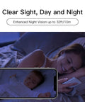 Woman monitoring baby on phone with All In One 1080P FHD WiFi Security Camera For Indoor Baby Monitor With Dual Band 5GHz Night Vision Two Way Audio Motion Alerts App Control And Custom Privacy Zones For Home And Pet Surveillance